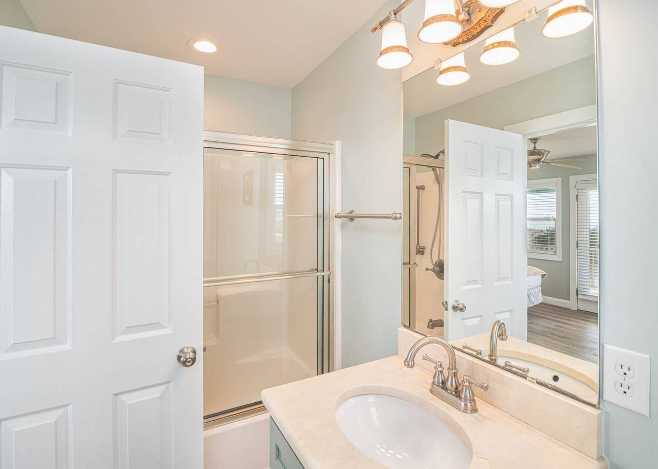 Bathroom with sink and shower.