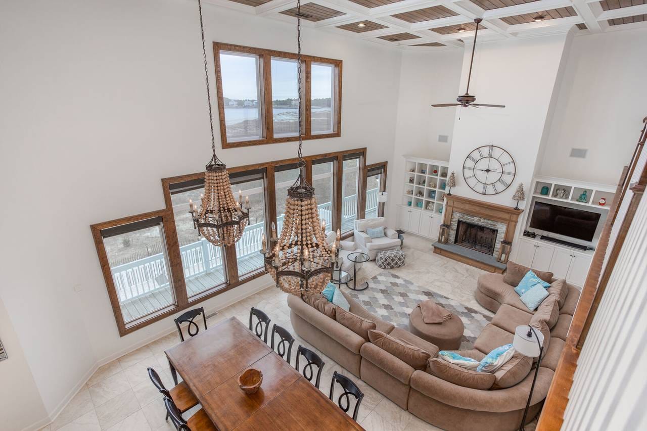 Spacious living room with chandeliers.