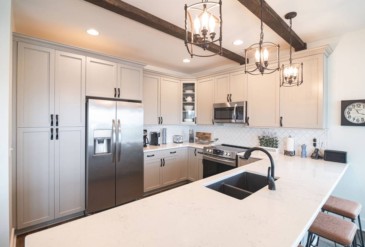 Modern kitchen with white cabinets.