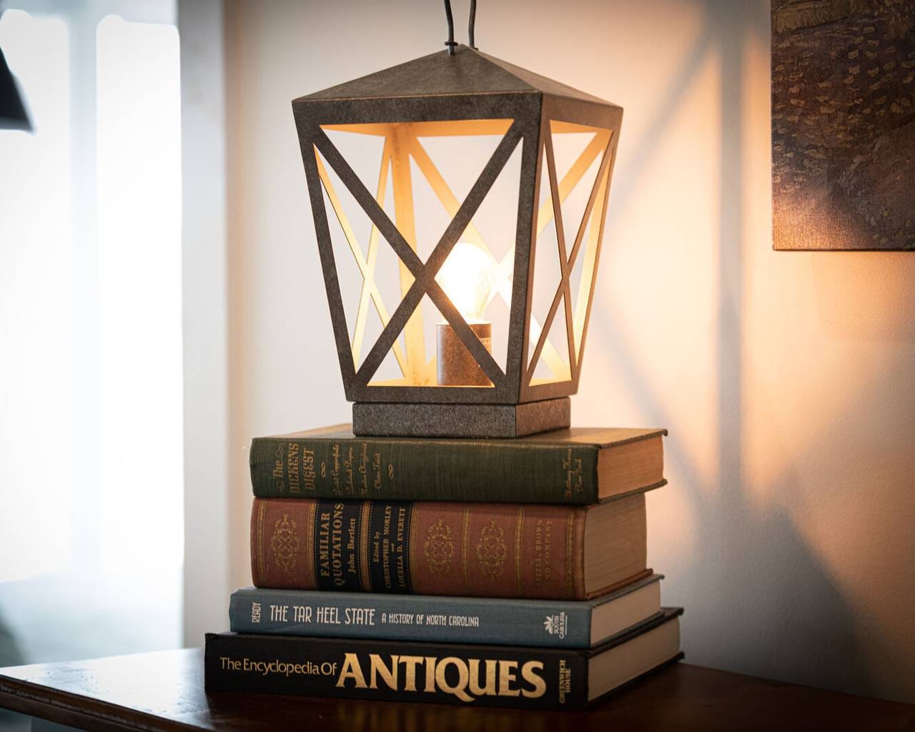 Lantern on stacked vintage books.