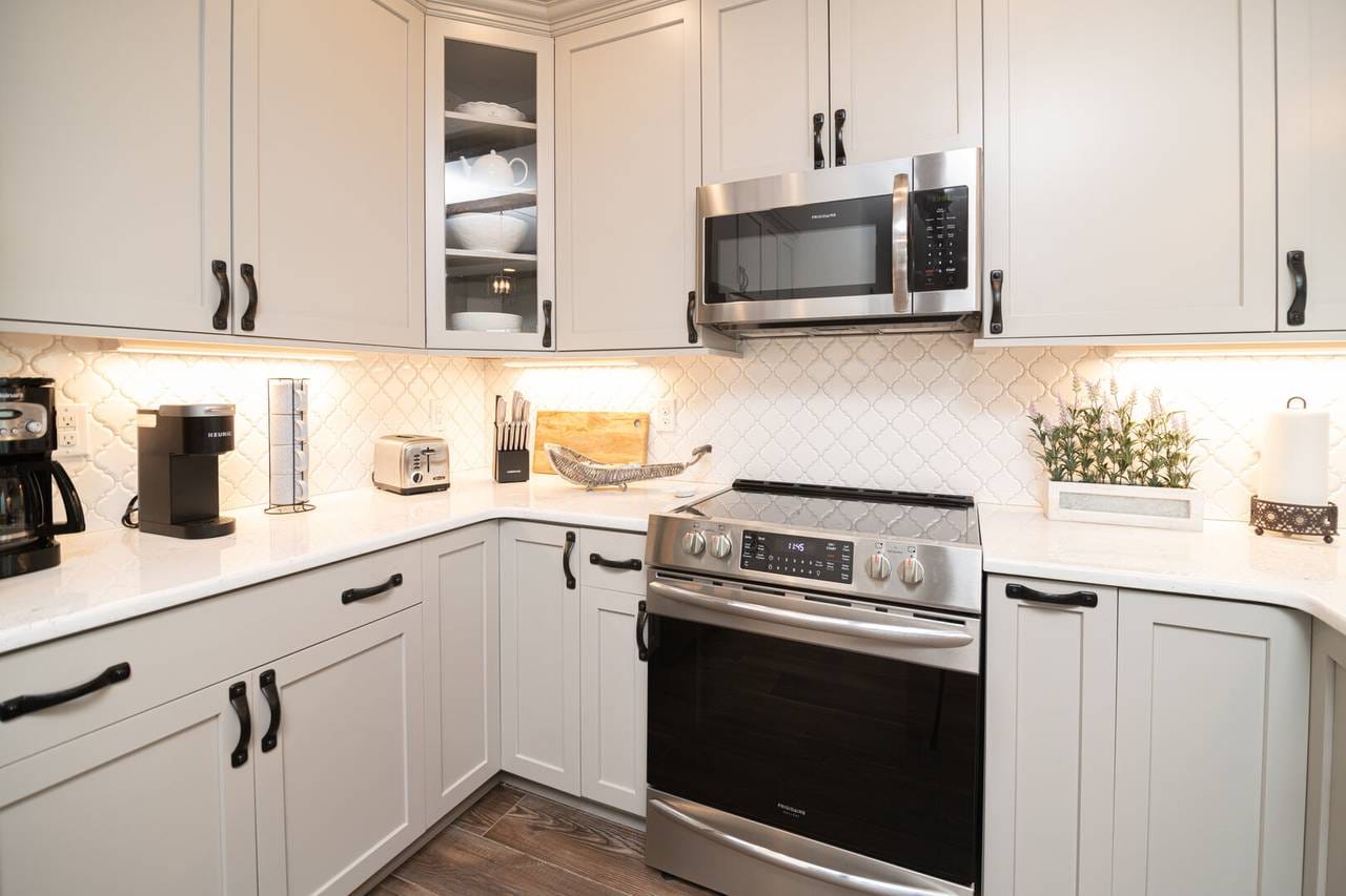 Modern kitchen with stainless steel appliances.