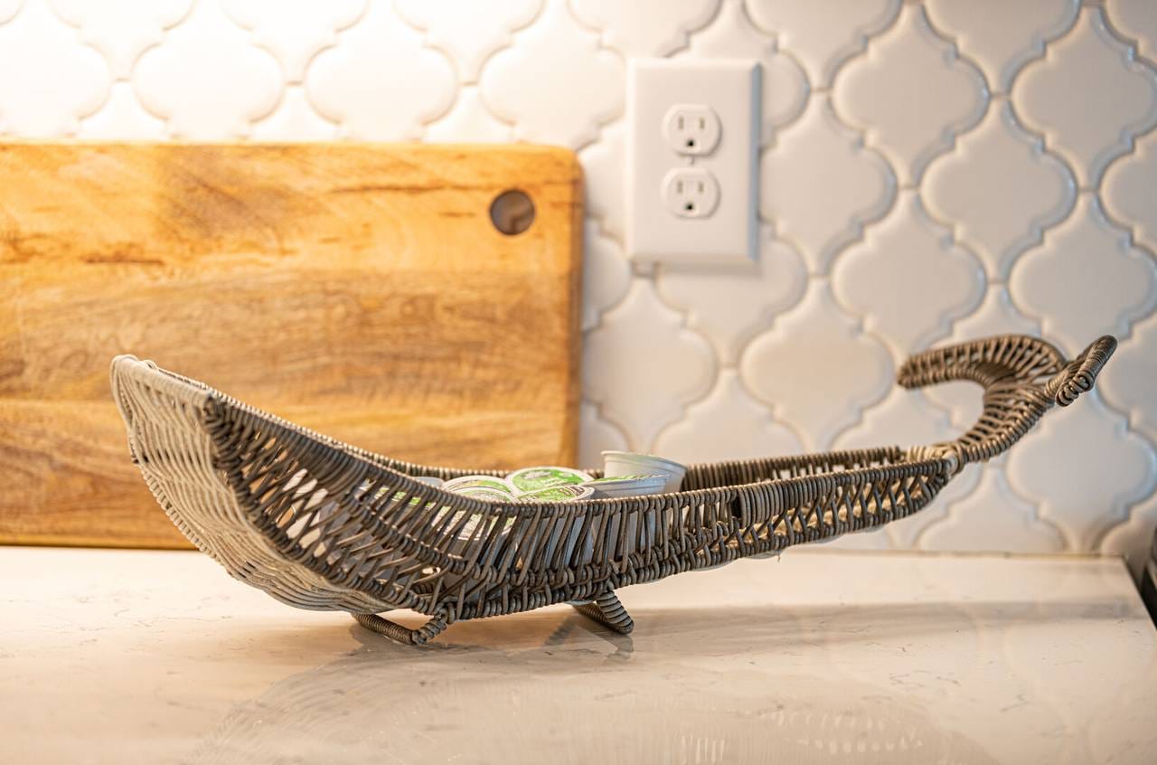 Wicker boat basket on countertop.