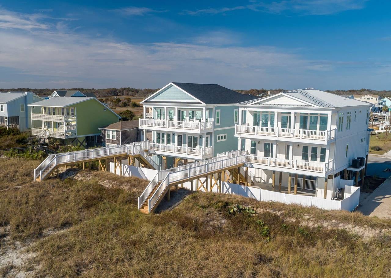 Beachfront houses with connecting boardwalks.