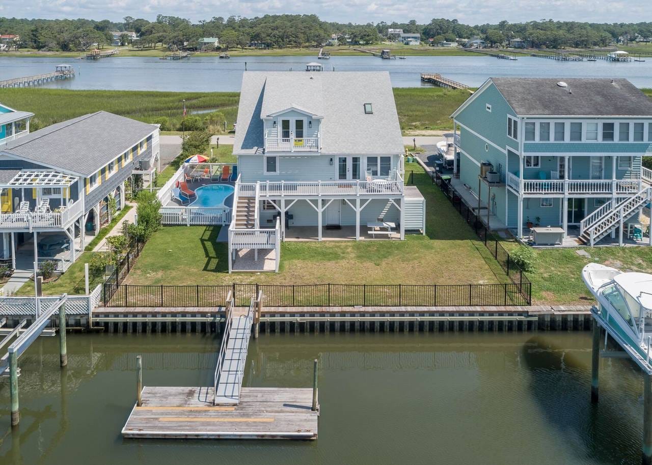 Waterfront house with backyard pool.