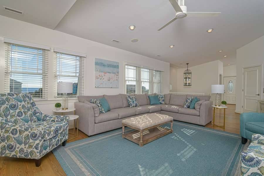 Modern living room with blue accents.