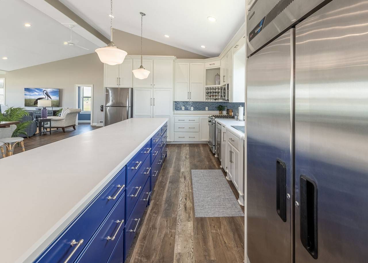 Modern kitchen with blue cabinets.