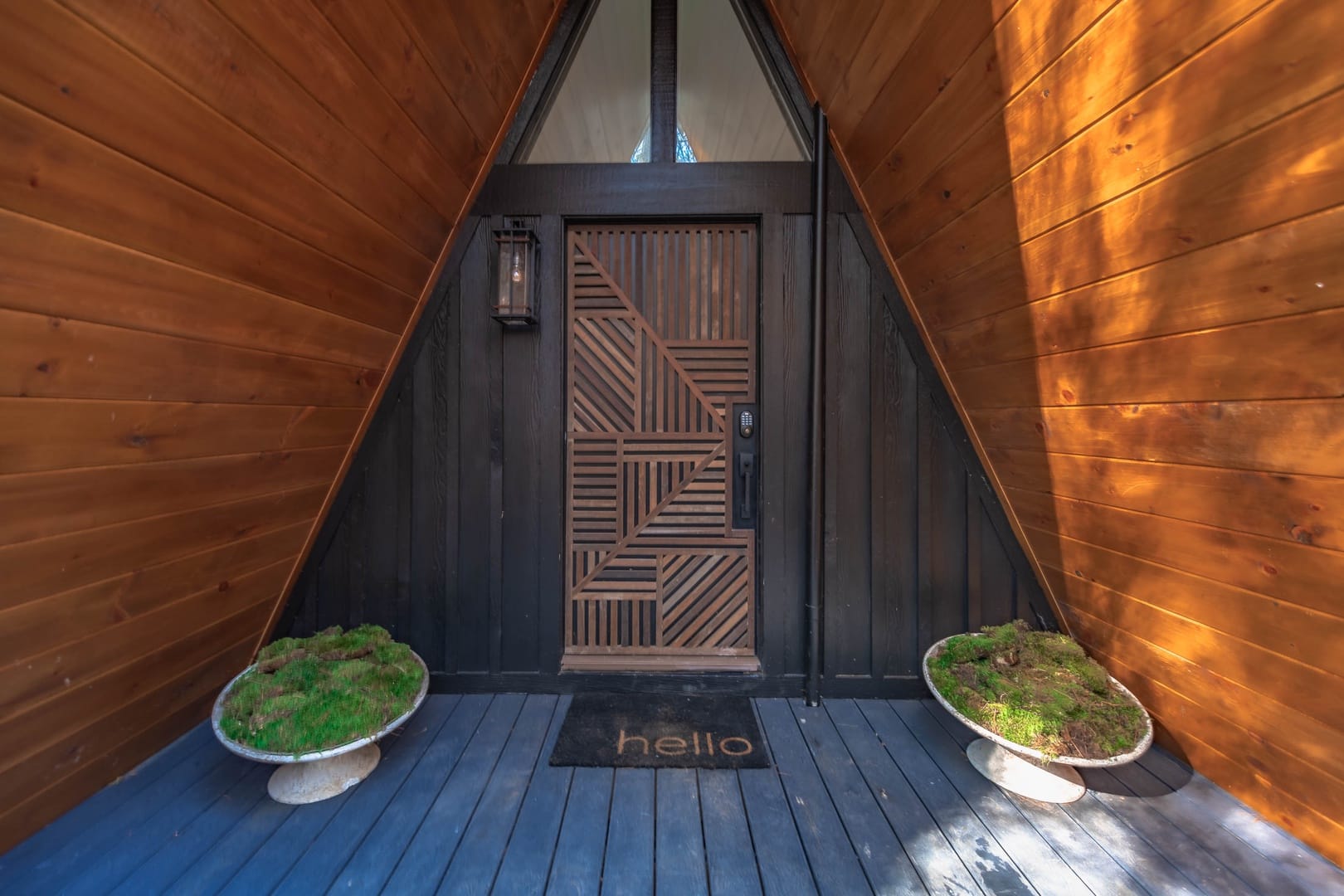 A-frame entrance with modern door.