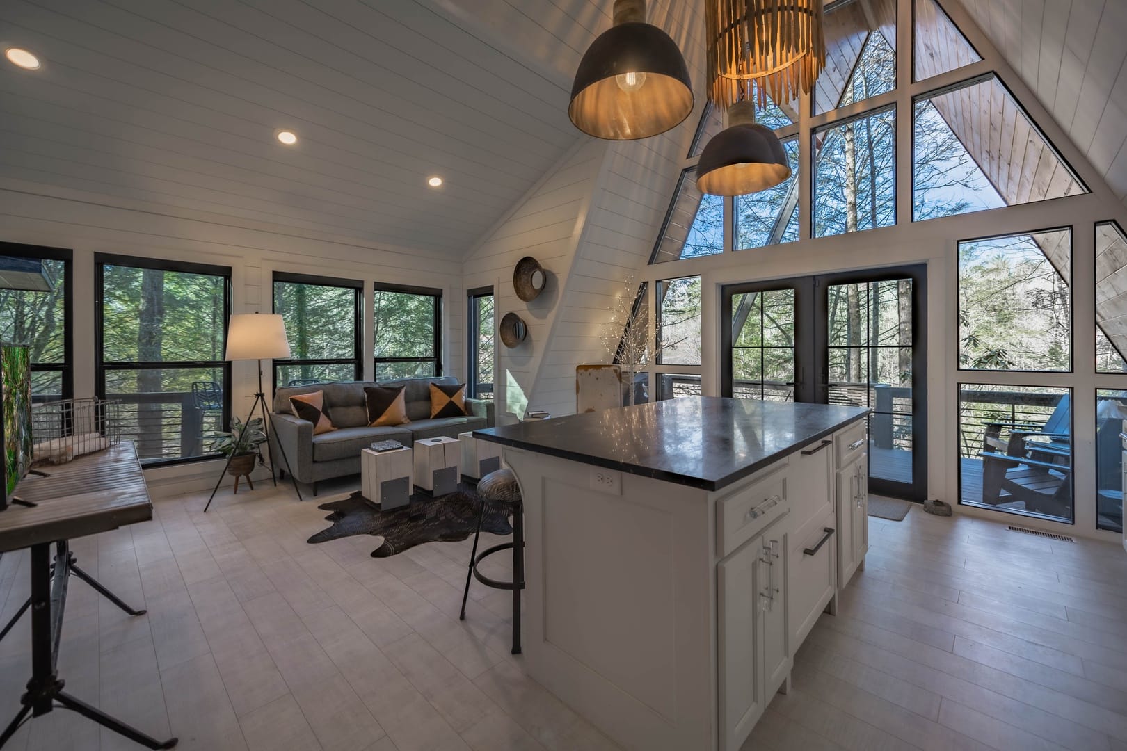 Modern A-frame cabin interior, daytime.