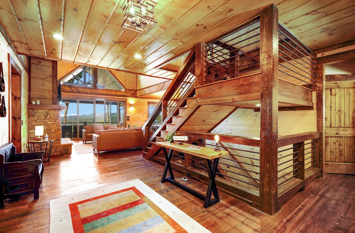 Rustic wood cabin interior, staircase visible.