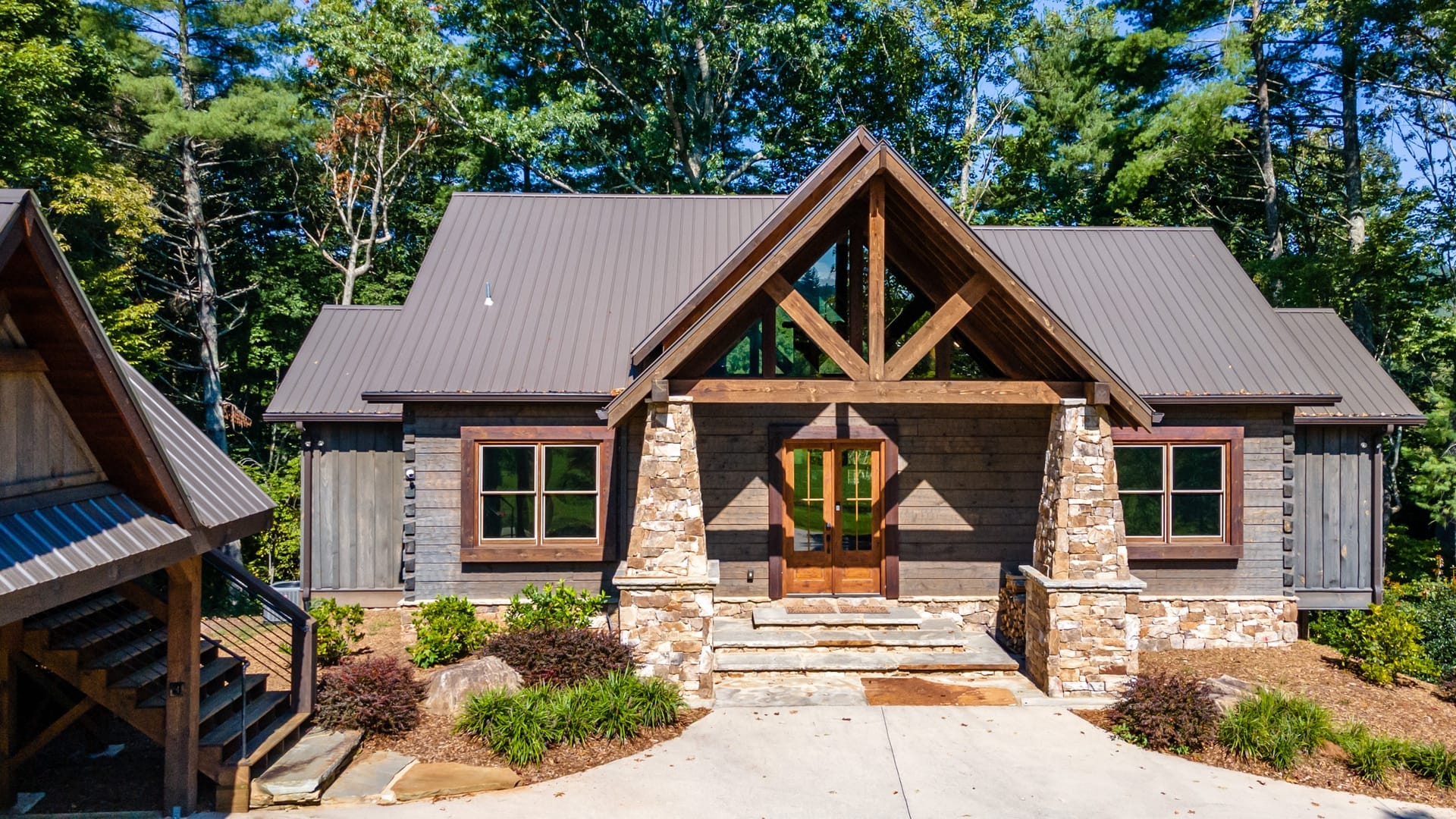 Rustic cabin with stone entrance.