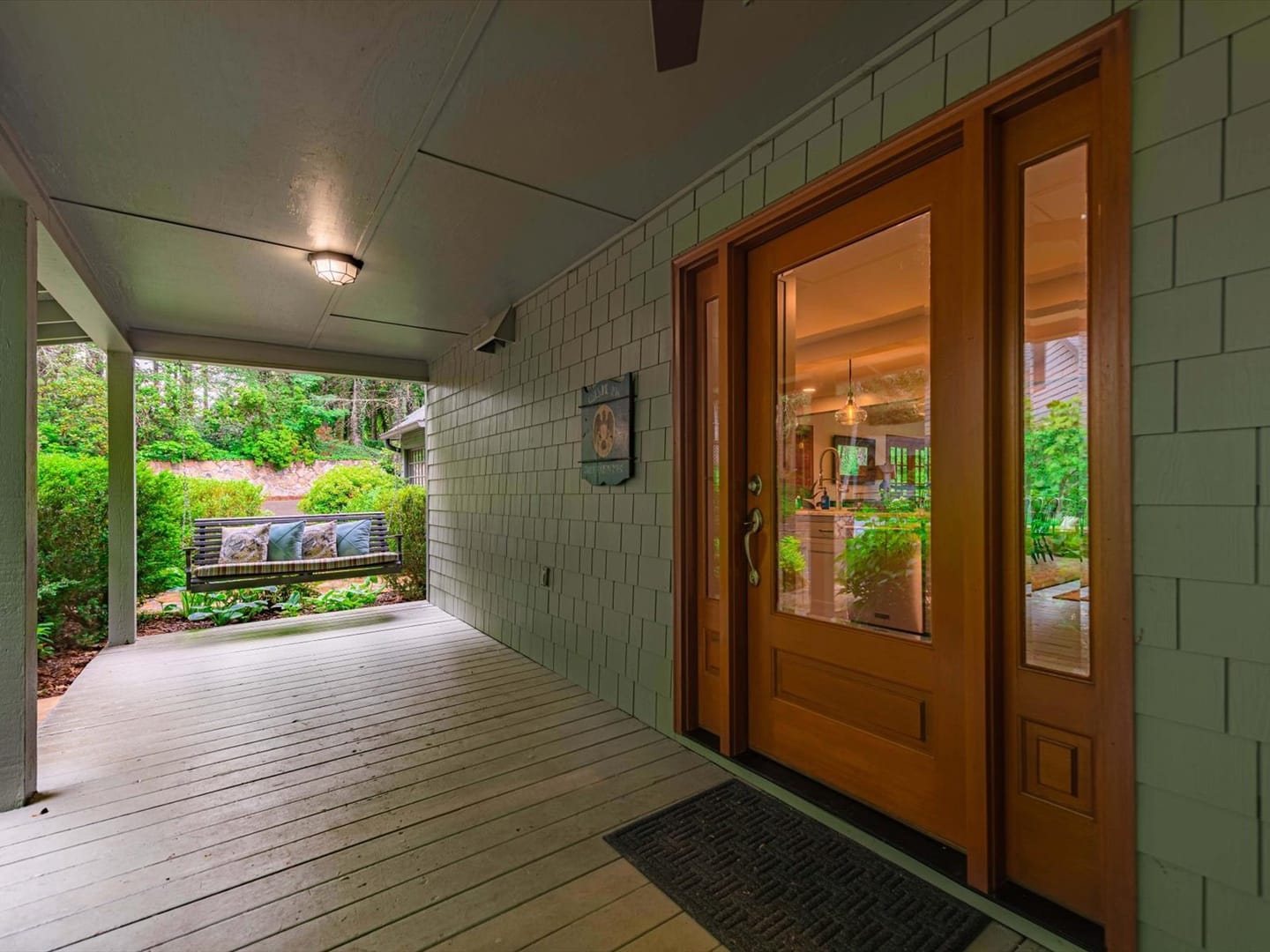 Porch with bench and door.