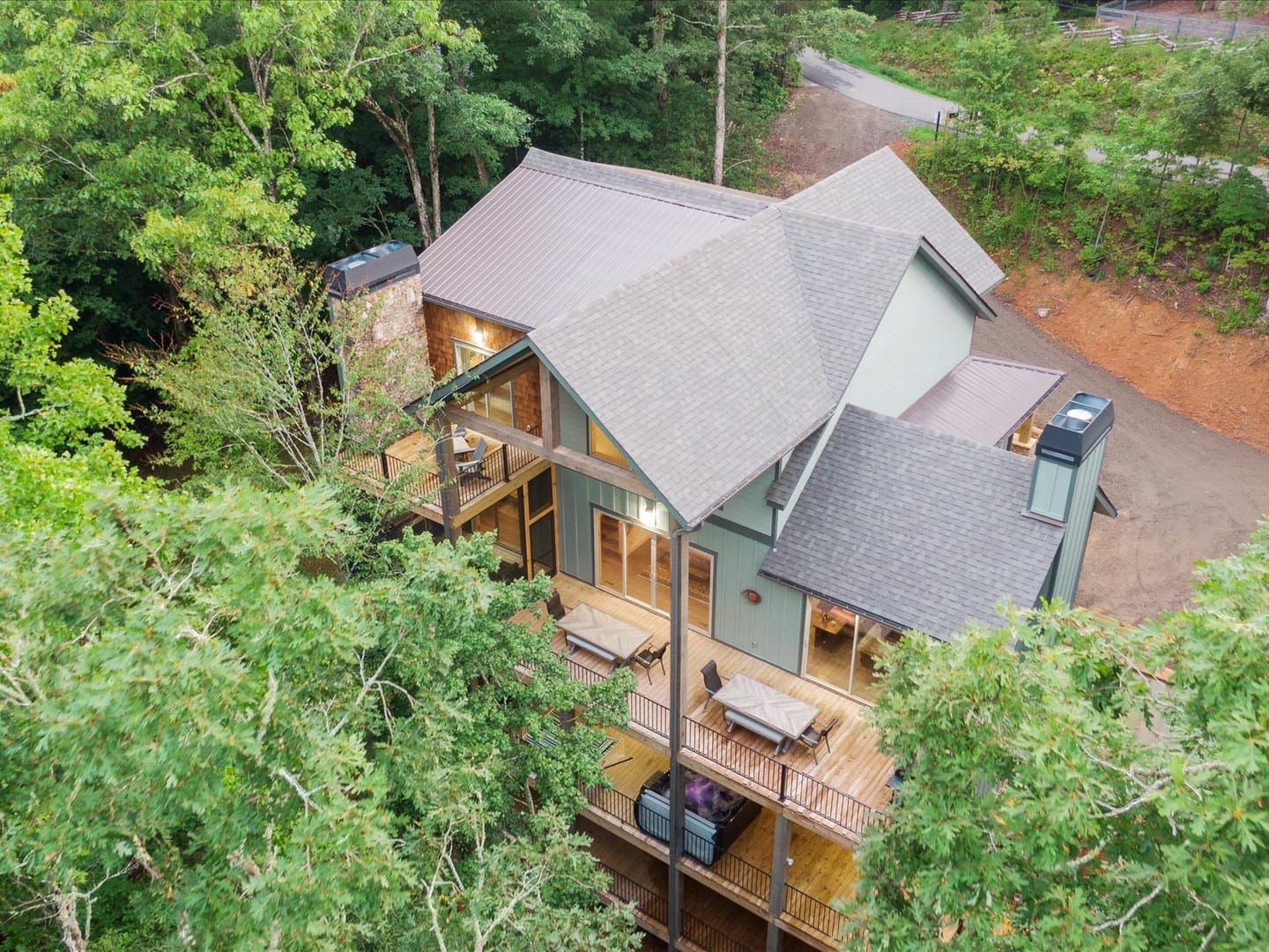 House surrounded by lush trees.