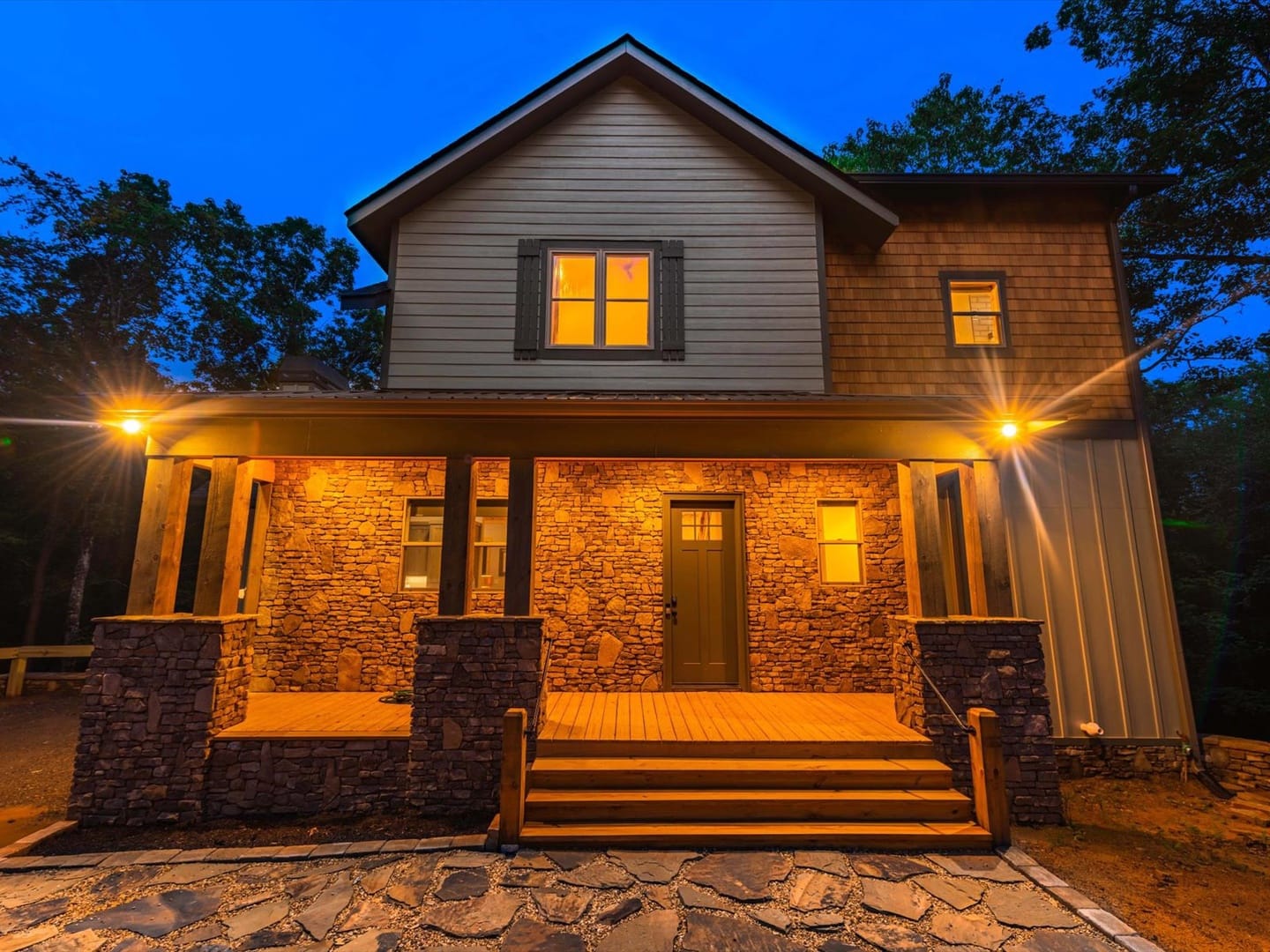 Cozy house with illuminated porch.