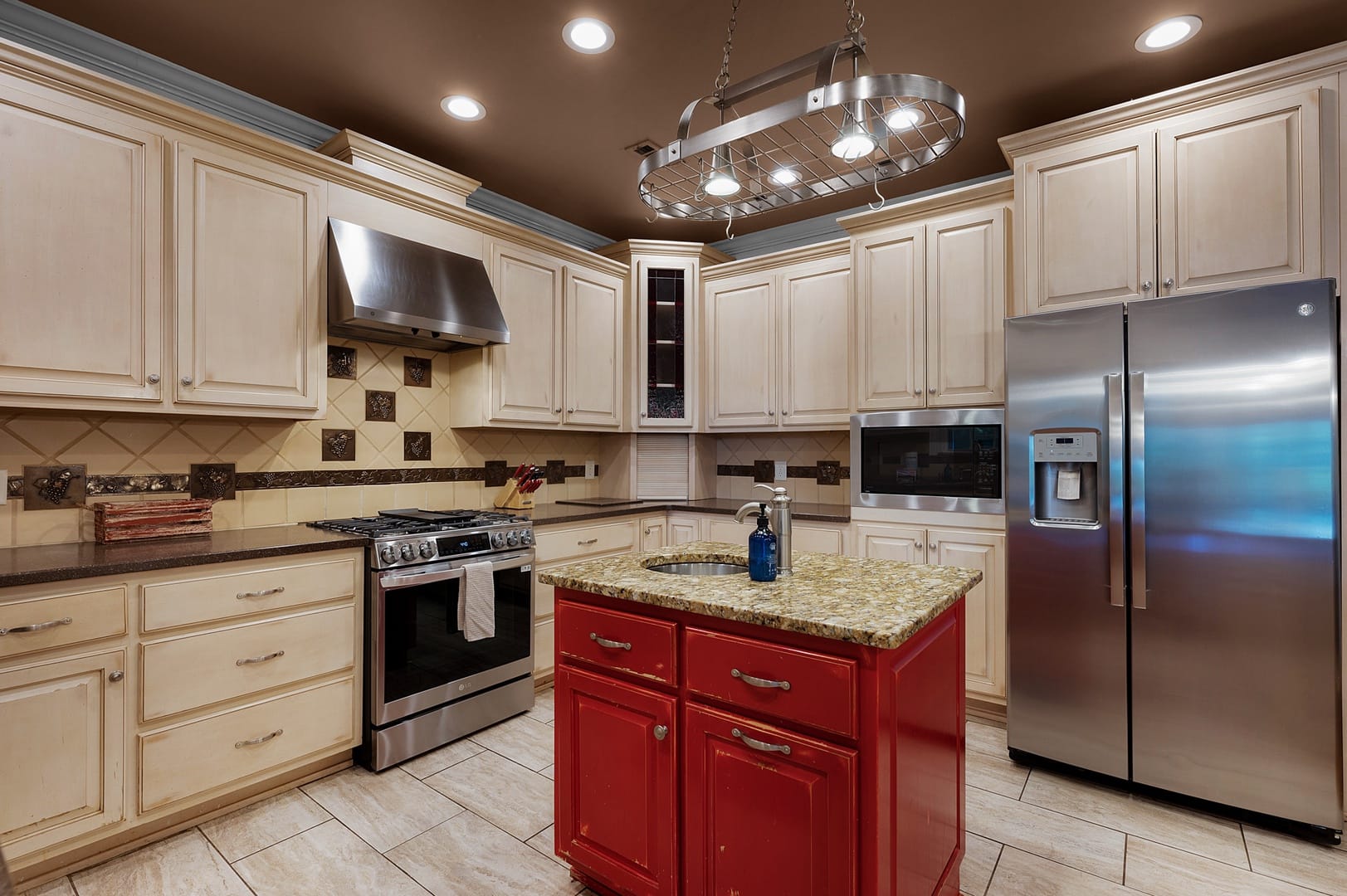 Modern kitchen with red island.