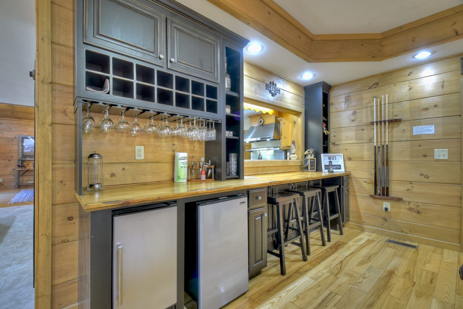 Wooden home bar with stools.