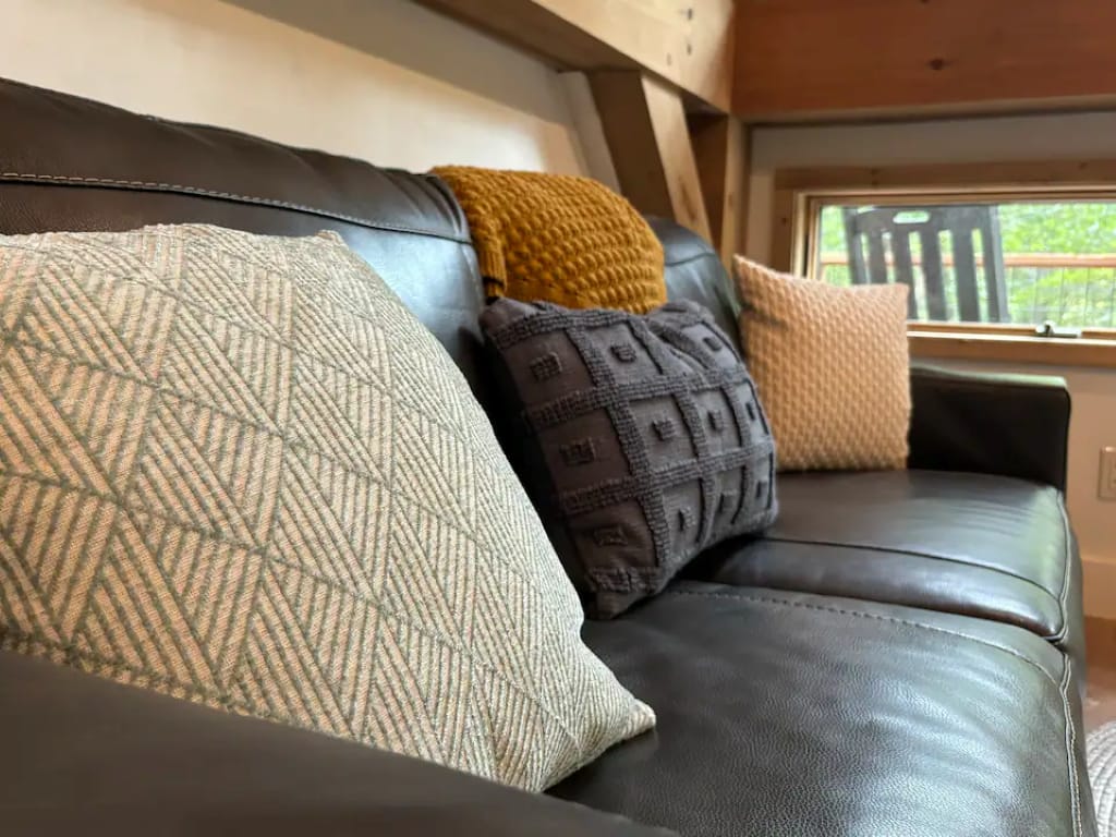 Couch with assorted decorative pillows.