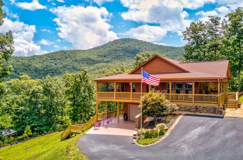 Mountain cabin with American flag.