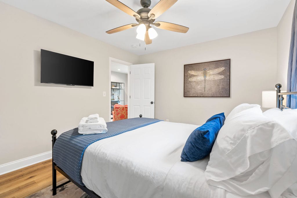 Modern bedroom with ceiling fan.