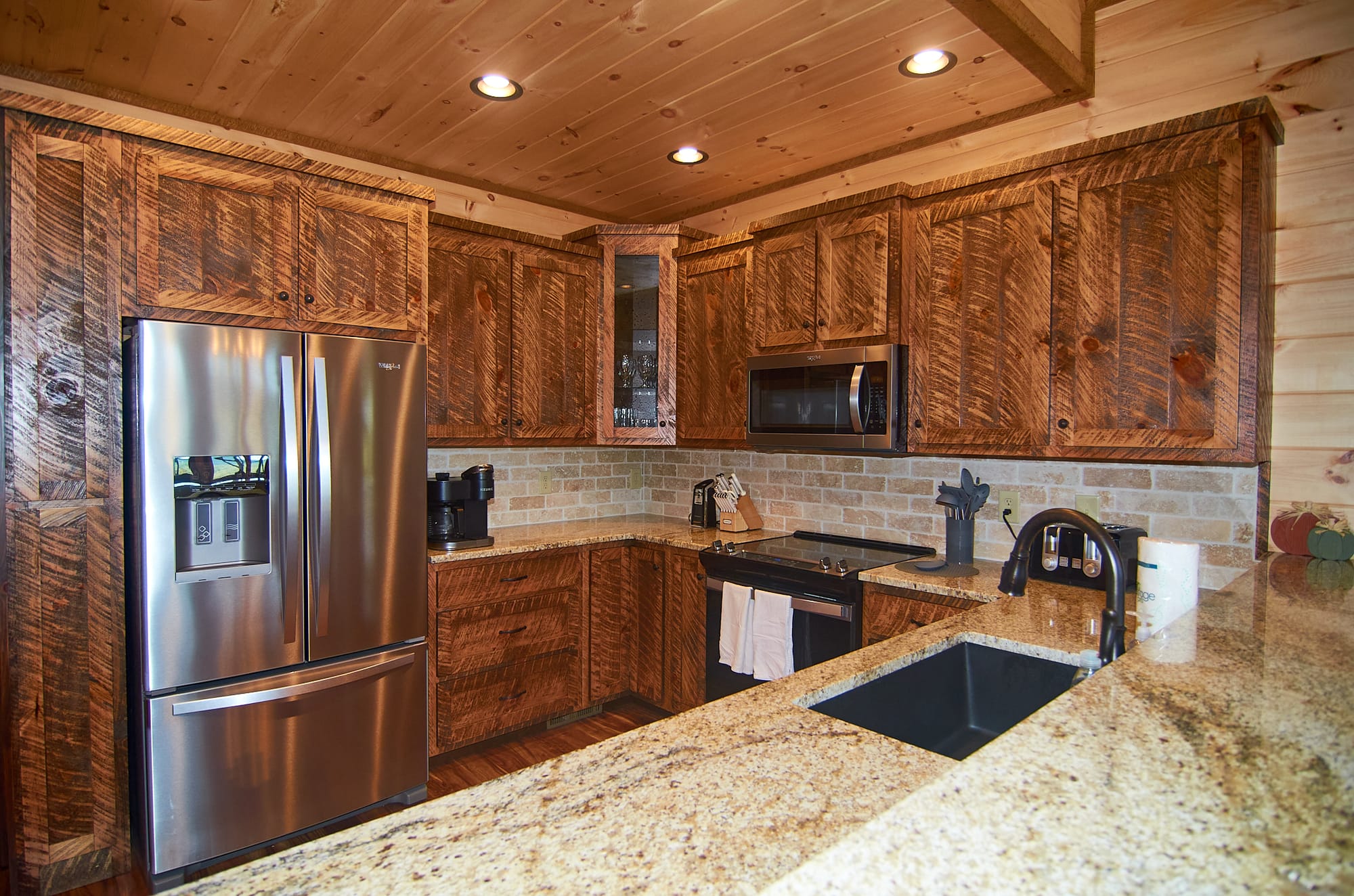 Rustic kitchen with wooden cabinets.