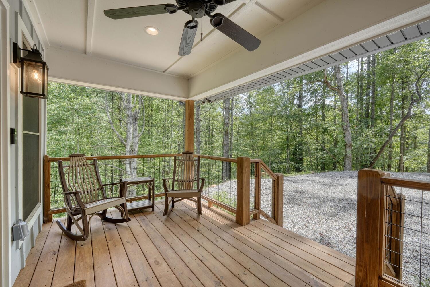 Porch with rocking chairs, forest view.