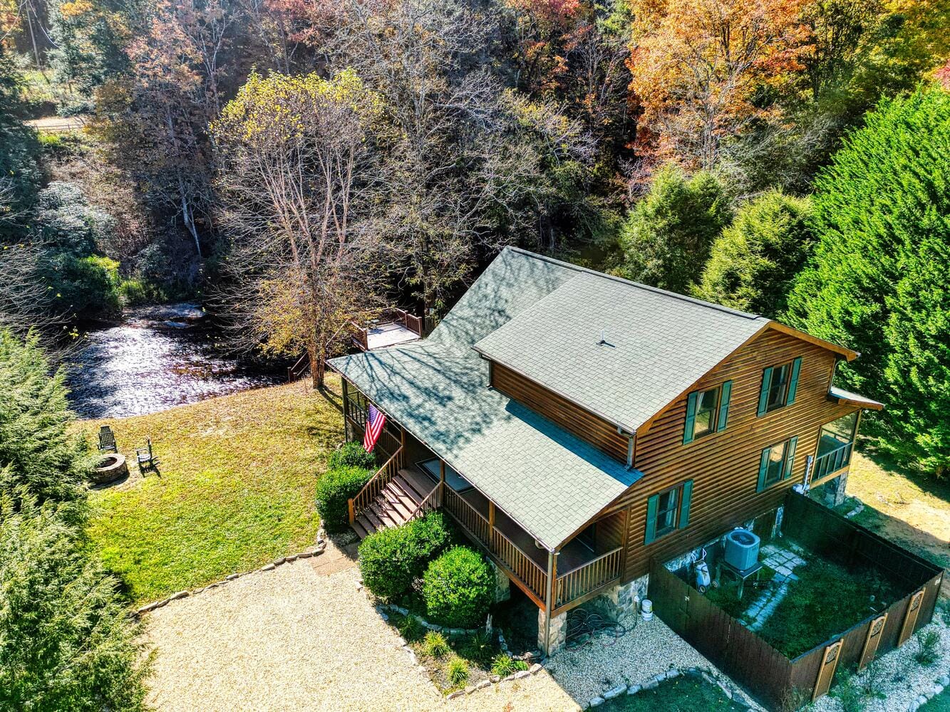 Rustic cabin by a forest stream.