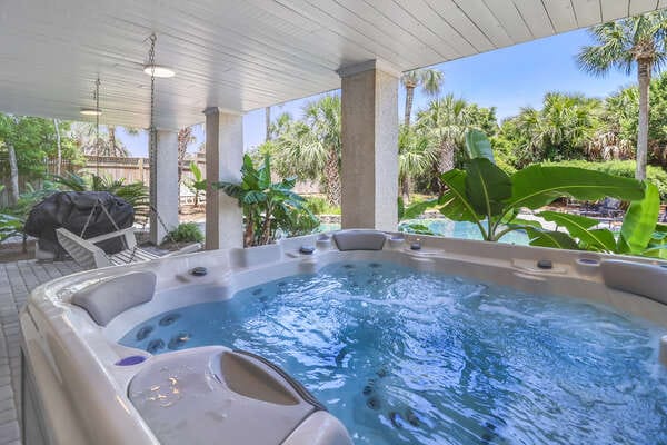 Outdoor hot tub, tropical surroundings.