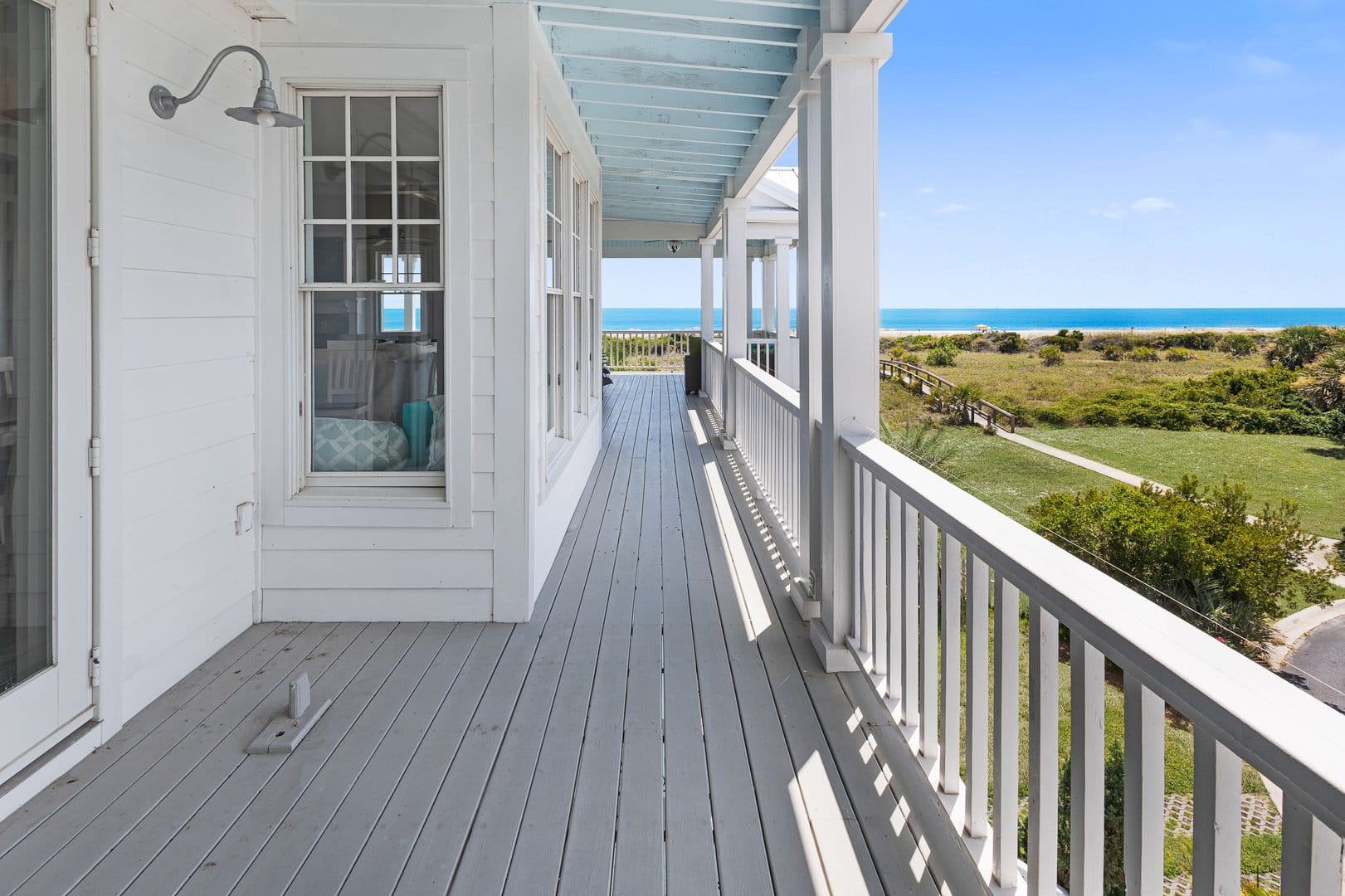 Beach house porch with ocean view.