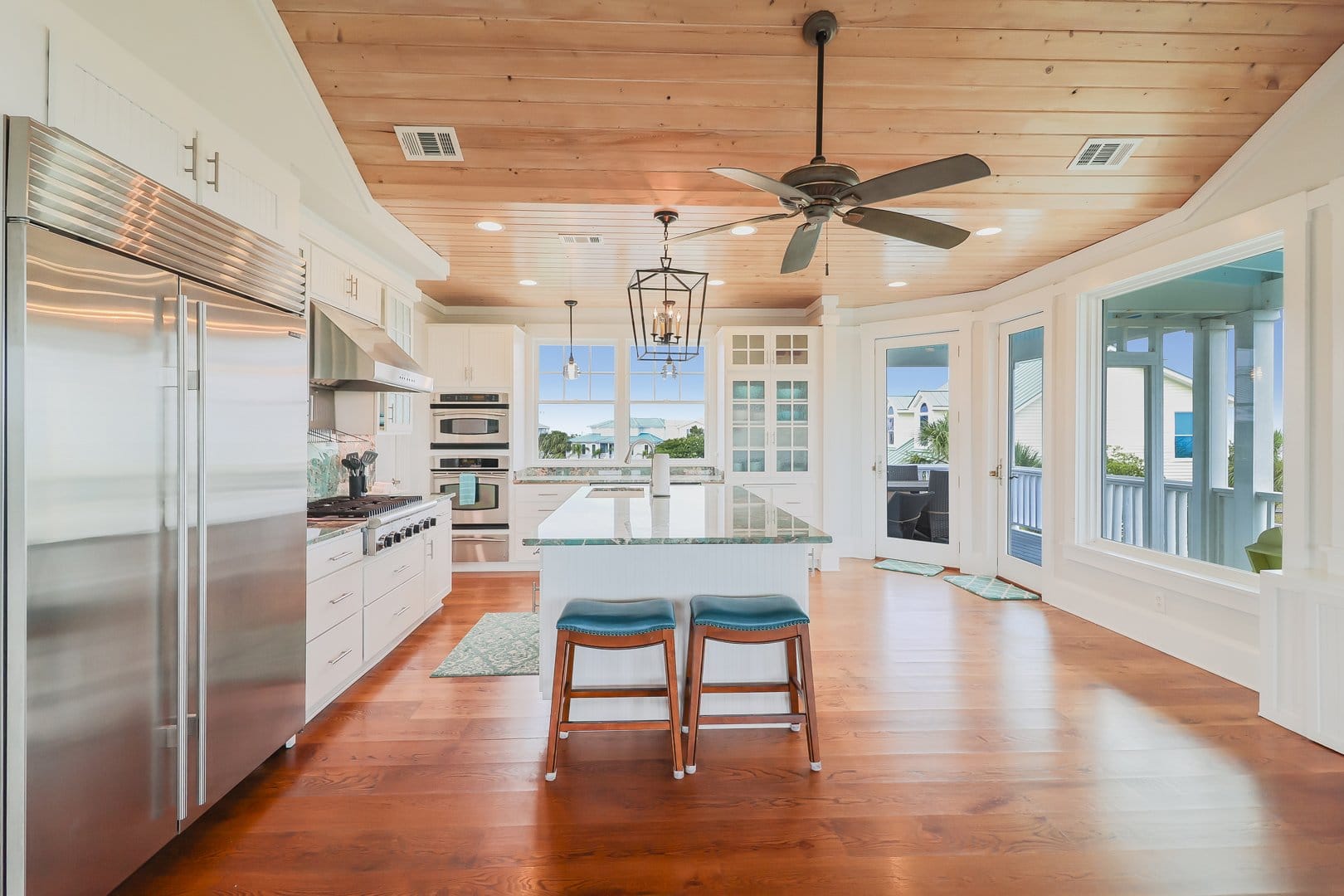 Bright kitchen with island and stools.