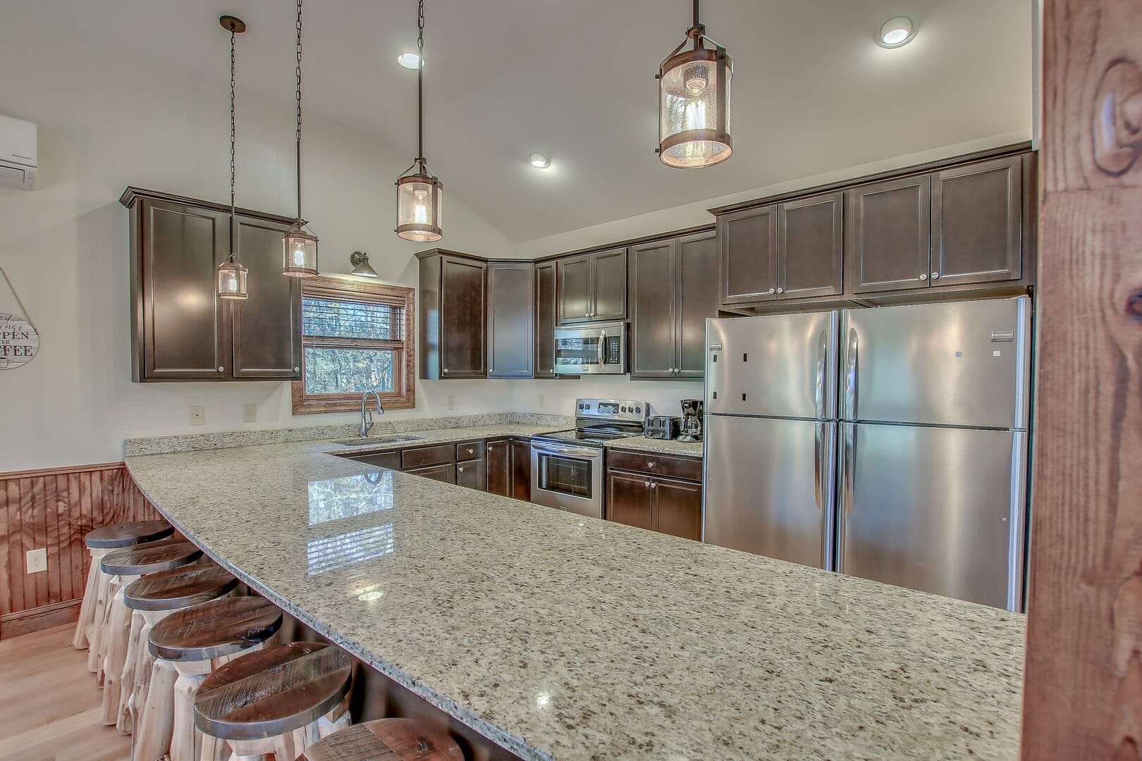 Modern kitchen with granite countertops.