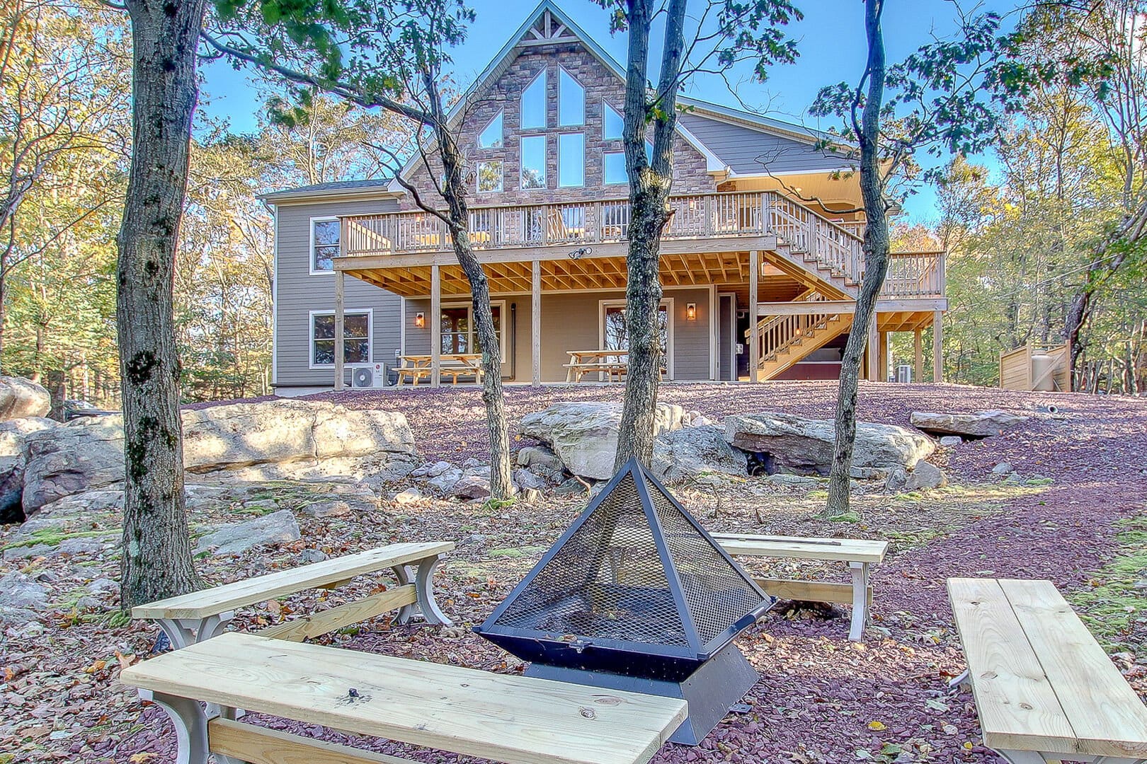 A-frame house with outdoor firepit.