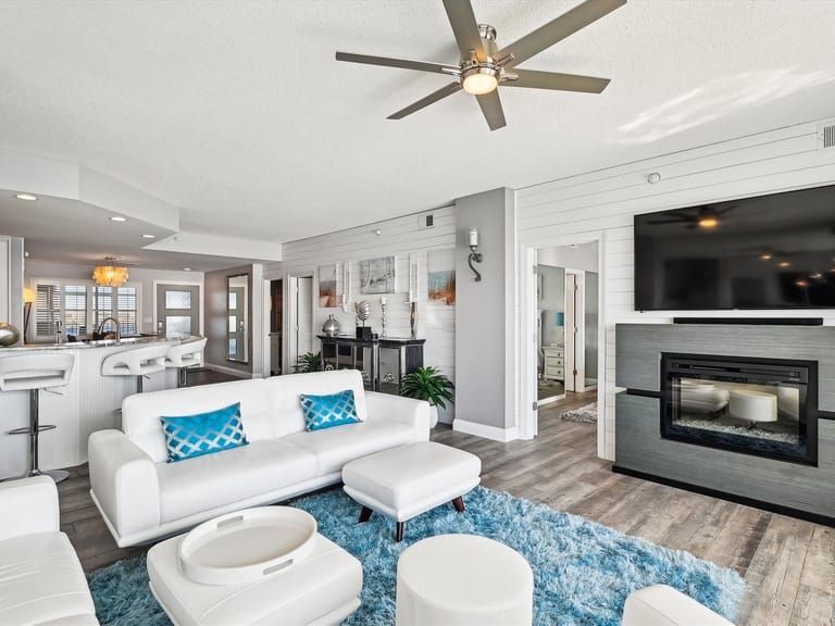 Modern living room with blue accents.