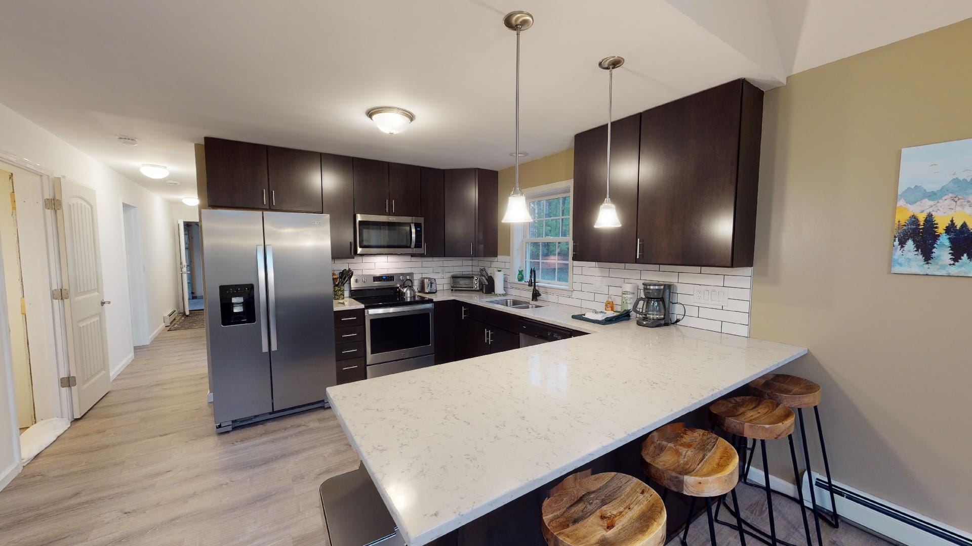 Modern kitchen with bar stools.