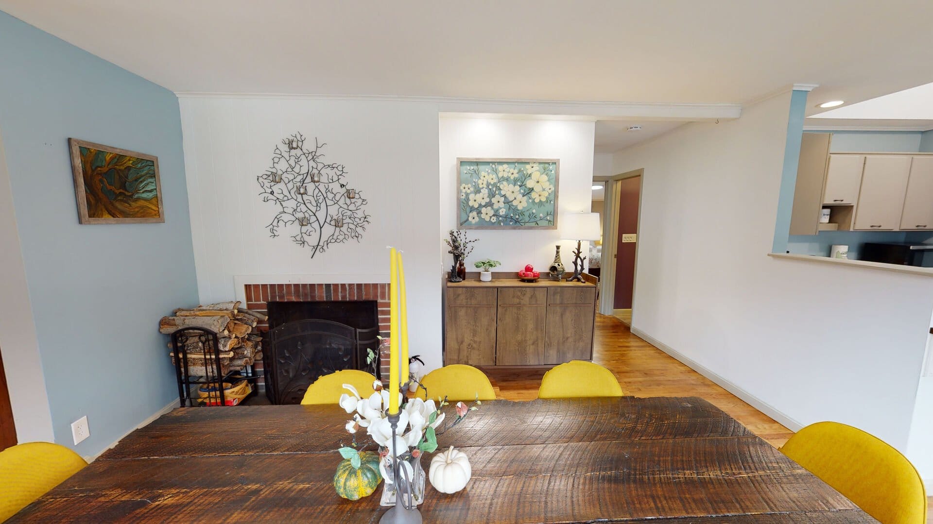 Dining room with fireplace and decor.