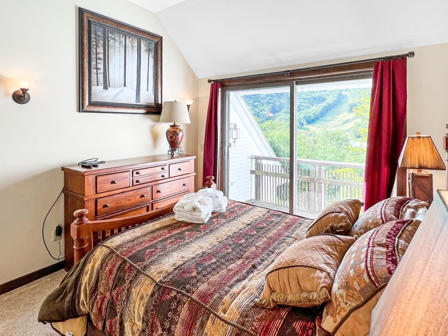 Bedroom with forest artwork, view.