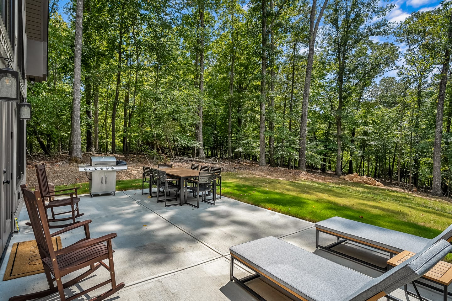 Outdoor patio with trees and furniture.