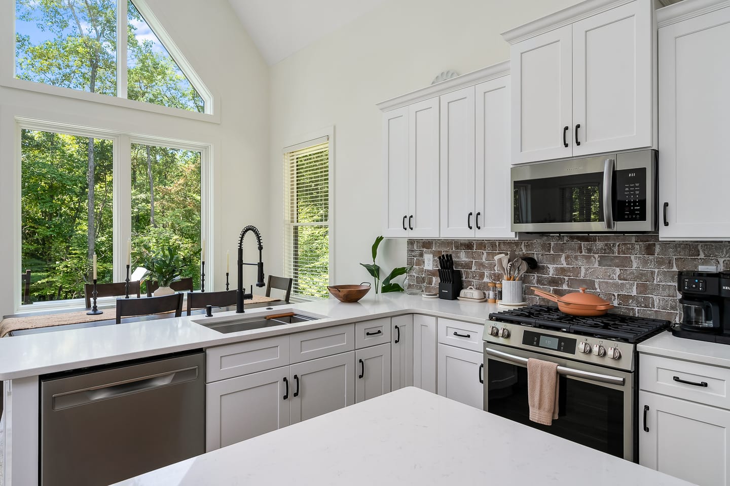 Modern kitchen with large windows.