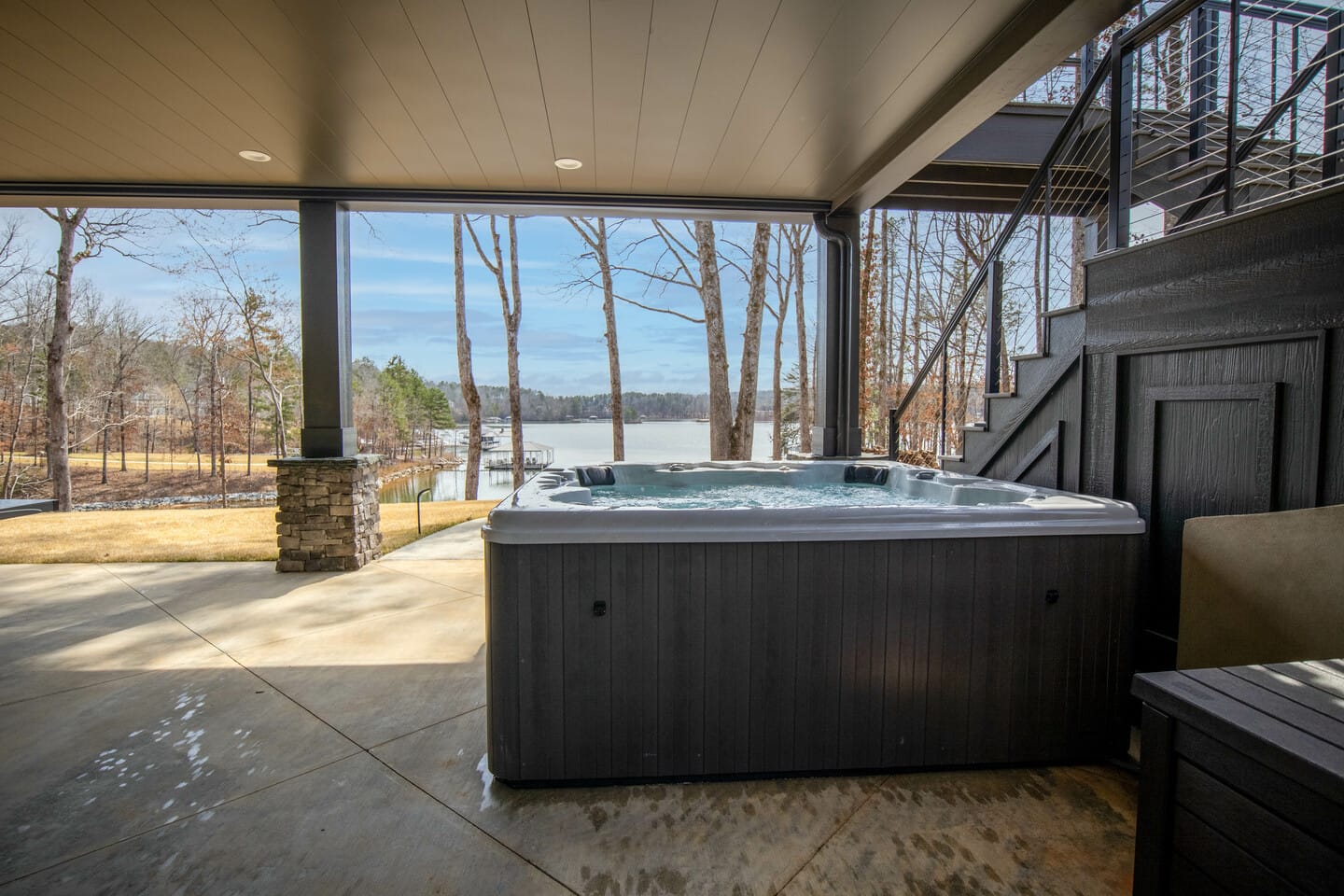 Hot tub on lakeside patio.