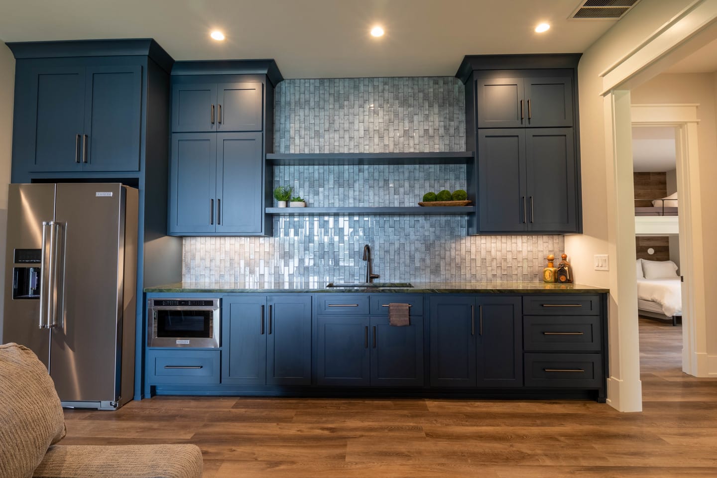 Modern kitchen with blue cabinets.