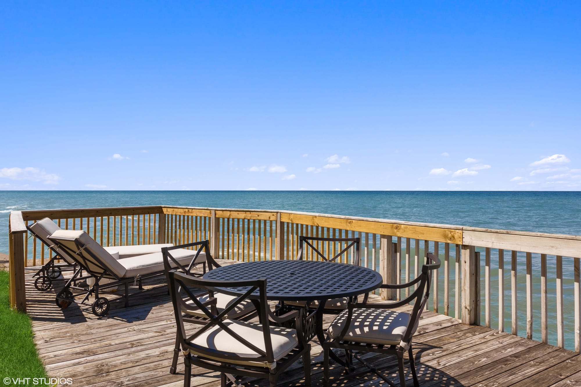 Ocean-view deck with outdoor seating.