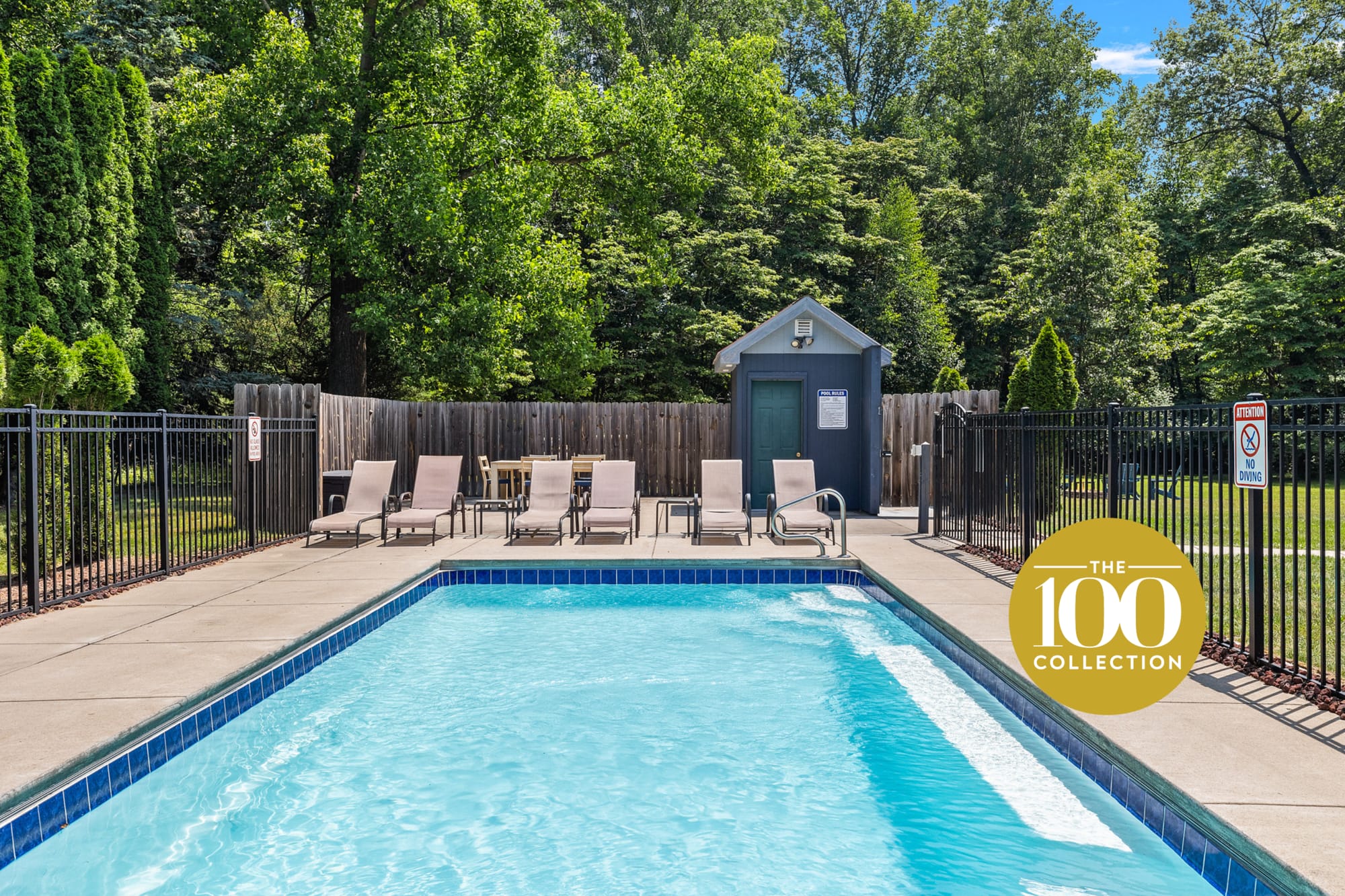 Outdoor pool with lounge chairs.