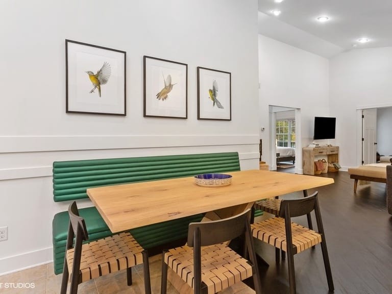 Dining area with bird artwork.