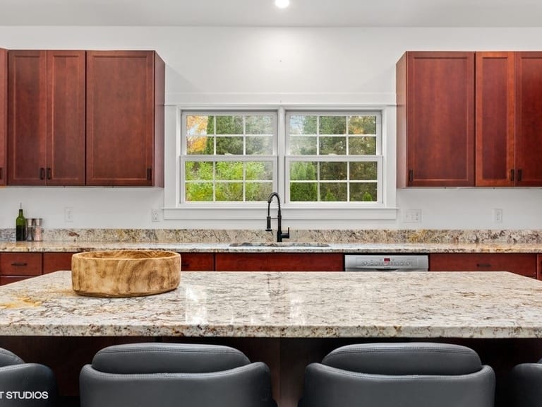 Modern kitchen with granite countertops.