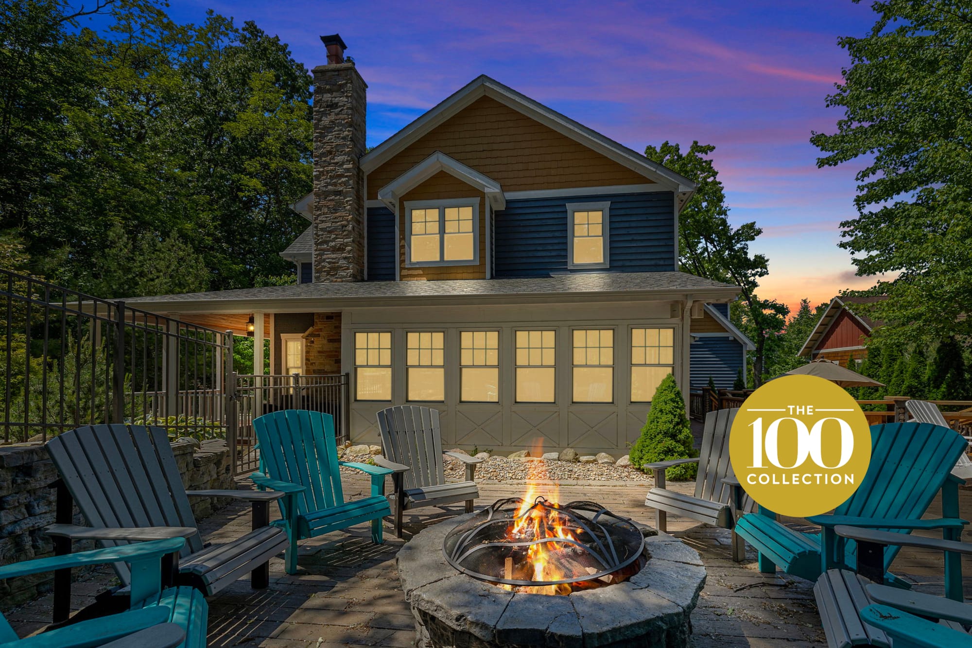 House with fire pit and chairs.