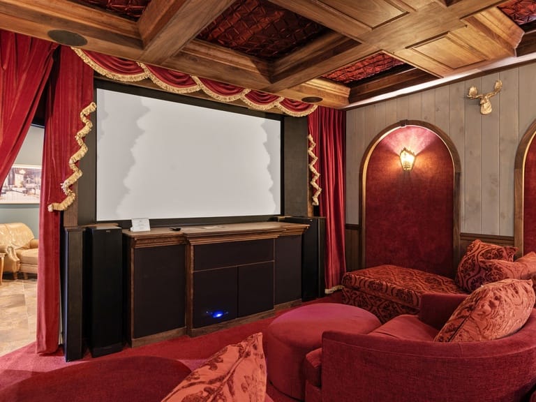 Home theater with red decor.