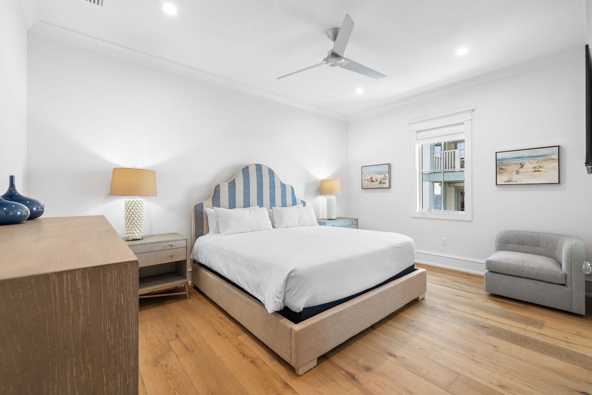 Modern bedroom with striped headboard.