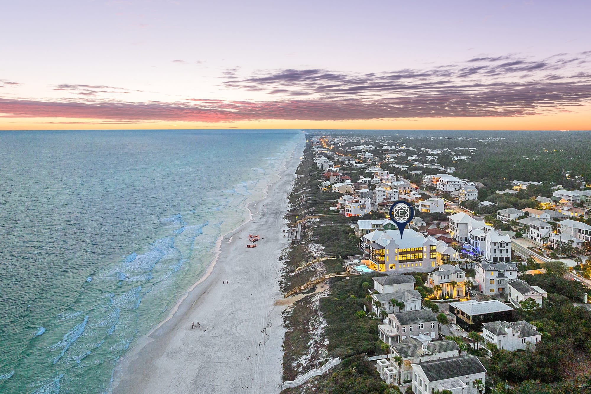 Sunset beach view with houses.