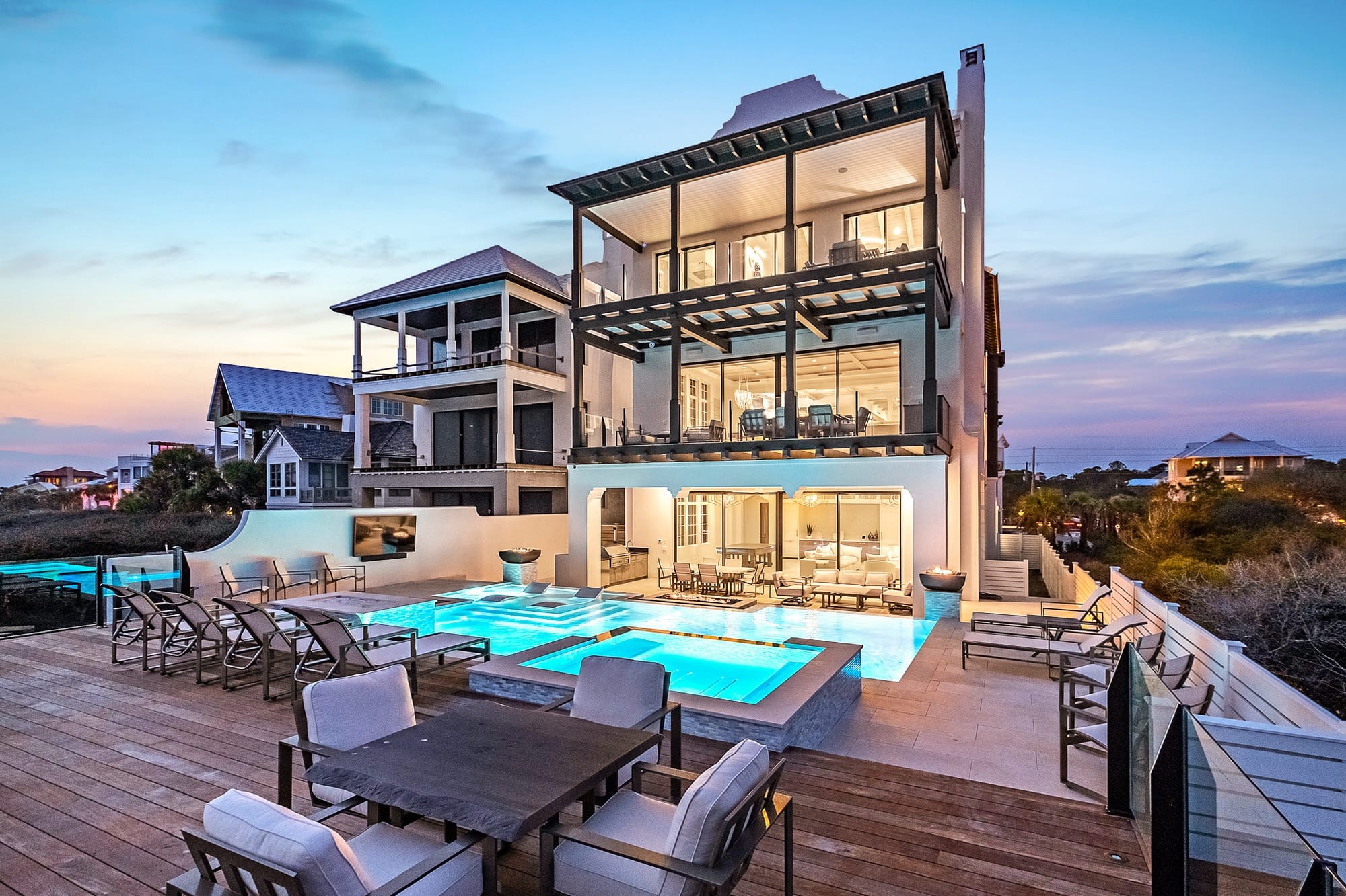 Modern house with pool at sunset.