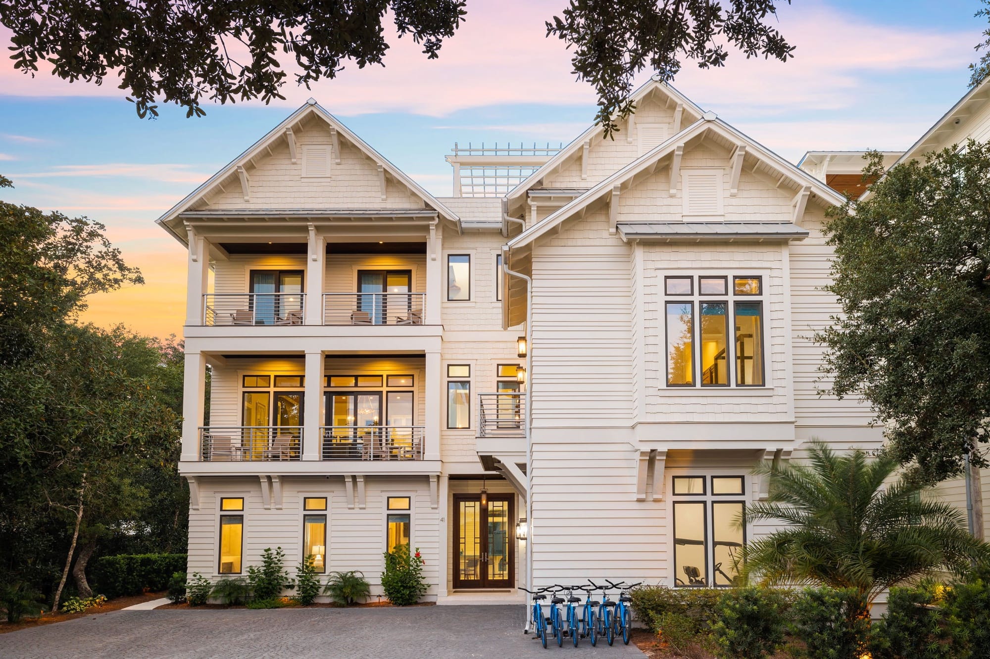 Three-story house at sunset.