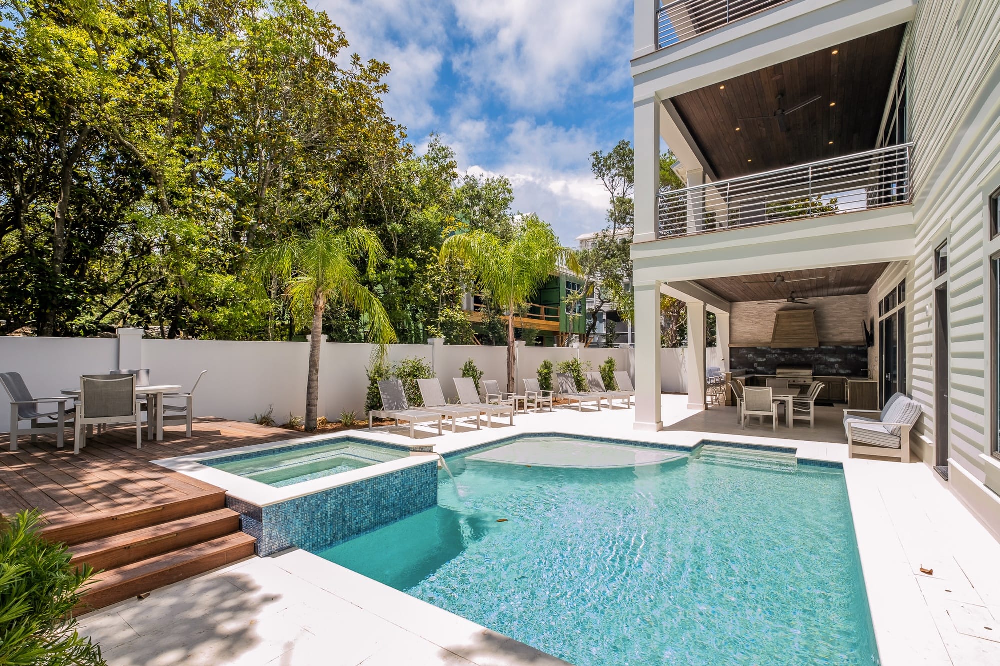 Outdoor pool with patio seating.