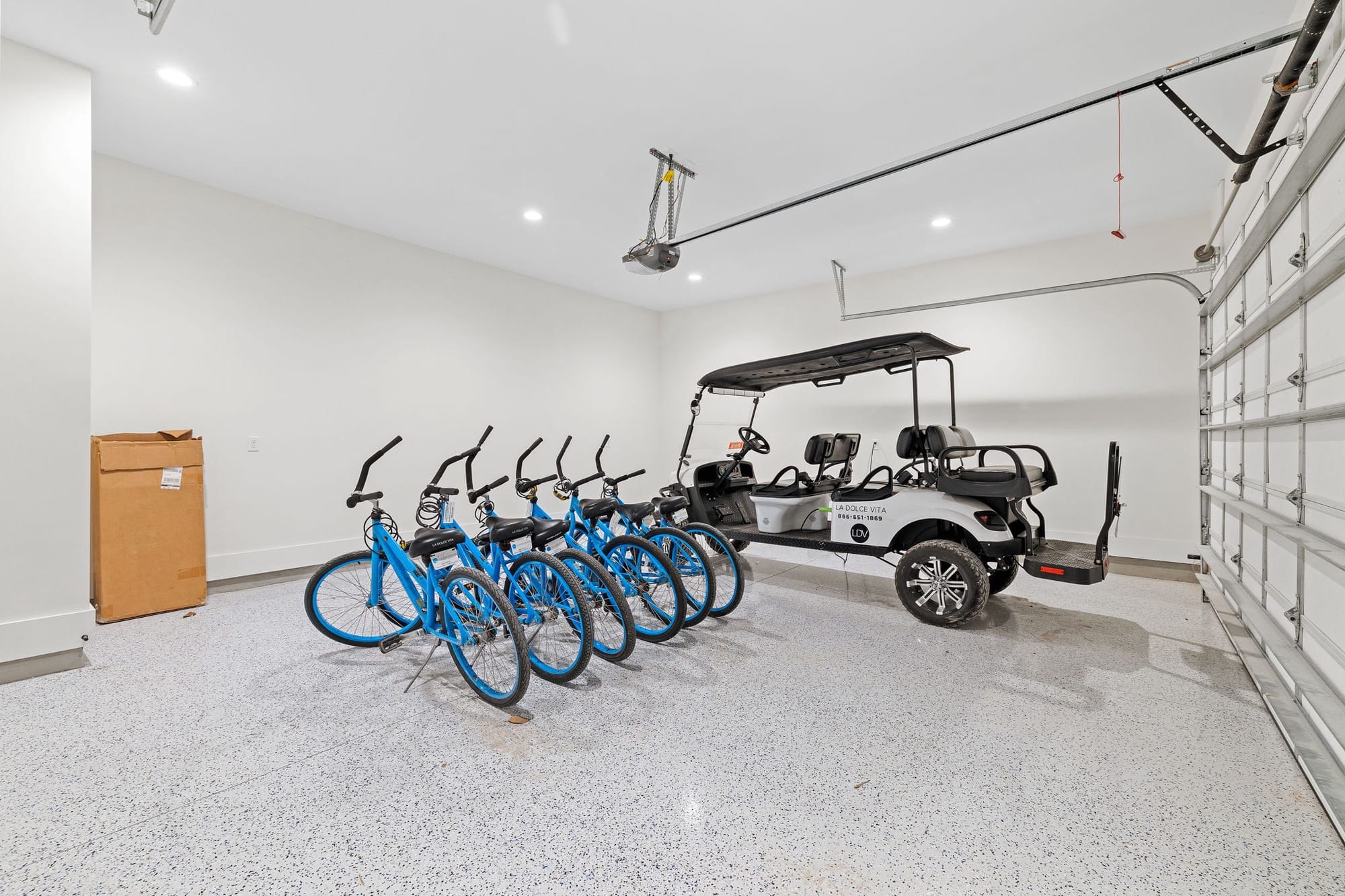 Garage with bikes and golf cart.